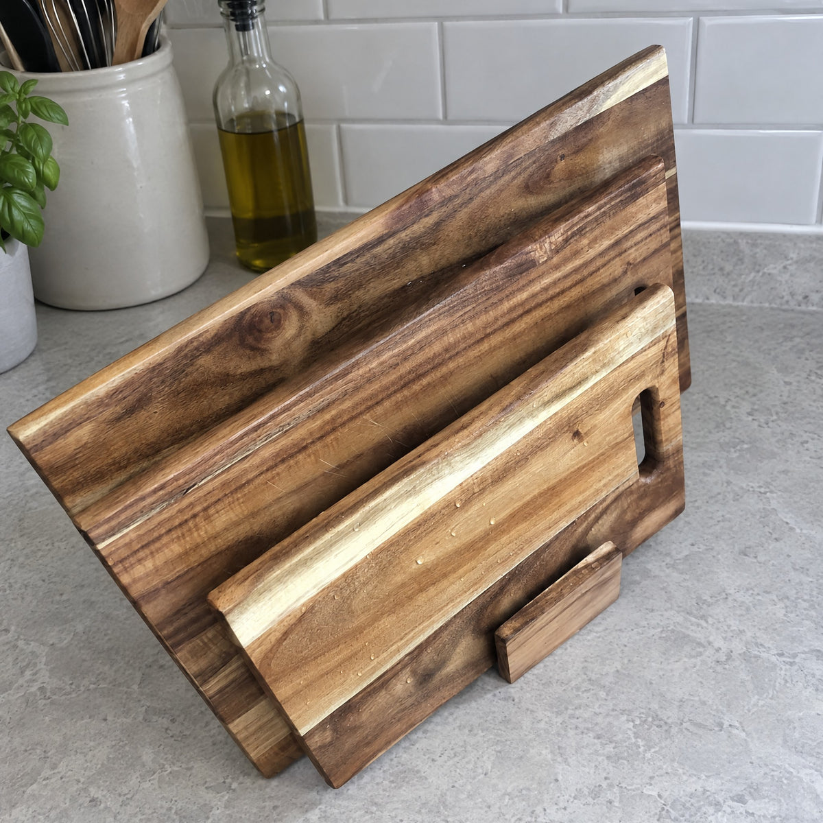 Freshly washed acacia boards drying on a stand