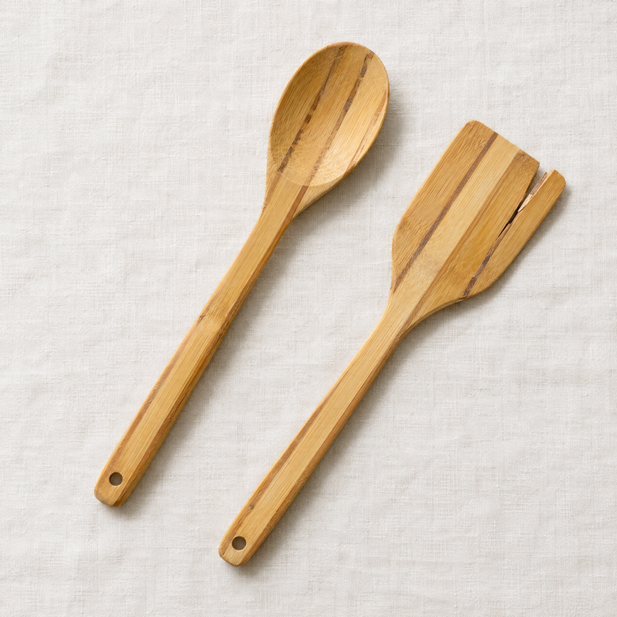 Bamboo spoon and spatula made of glued strips, one splitting at the seam