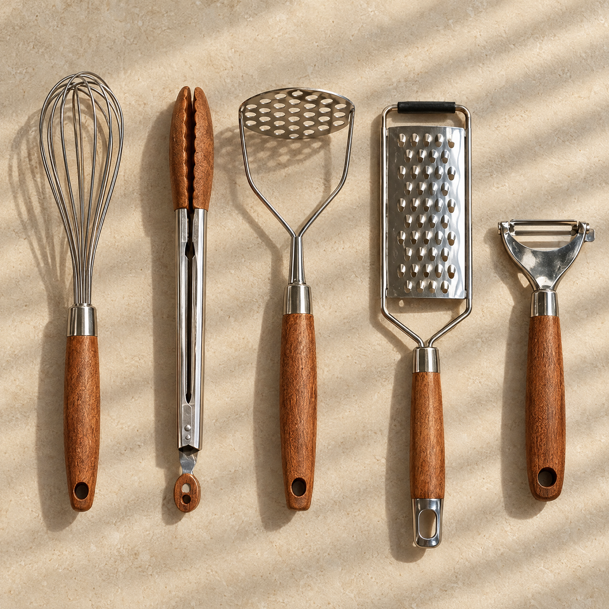 Whisk, tongs, potato masher, grater and peeler