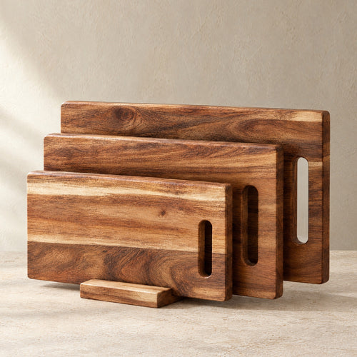 Complete set of three acacia cutting boards in the board stand
