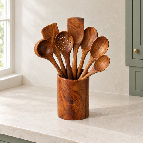 Teak utensil set in its teak holder on a limestone kitchen counter