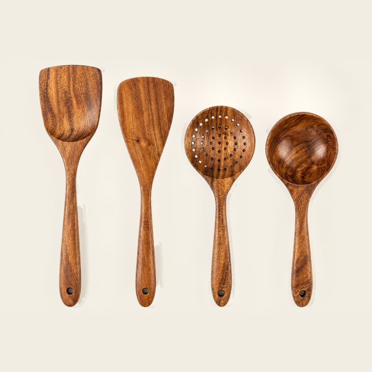 4-piece teak utensil set laid out: turner, stirrer, slotted spoon, ladle